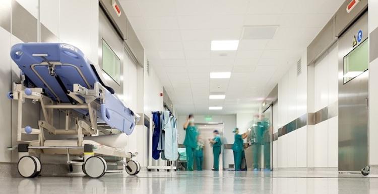 Hospital staff standing in a hospital corridor