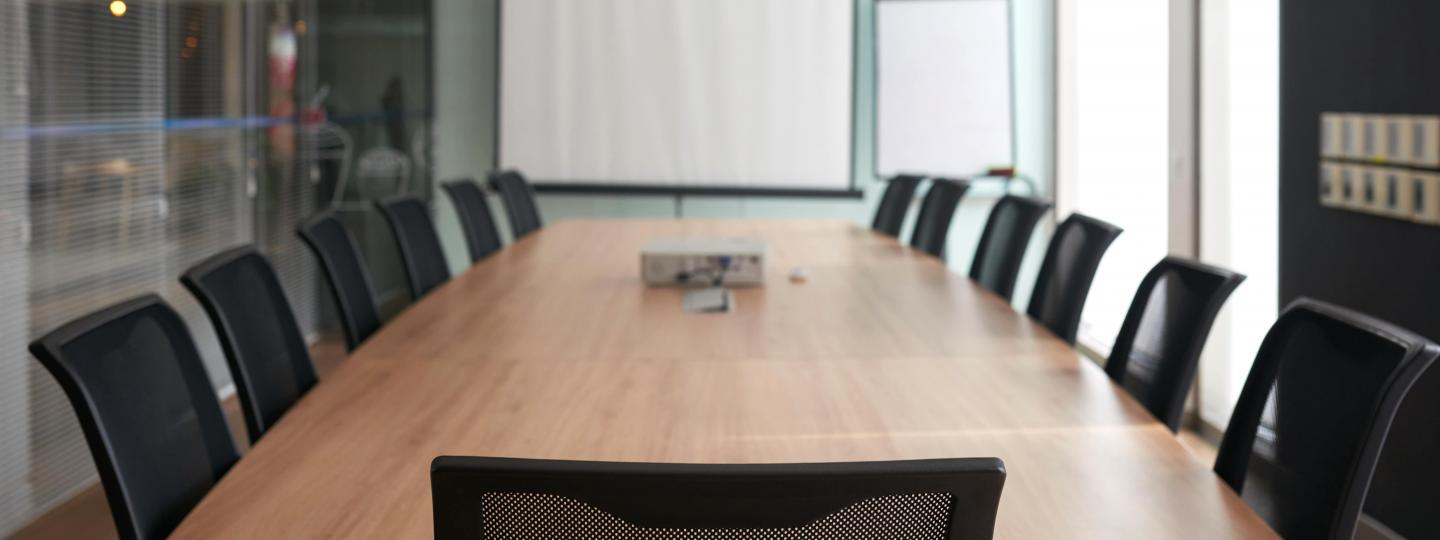 Meeting room with a table and chairs