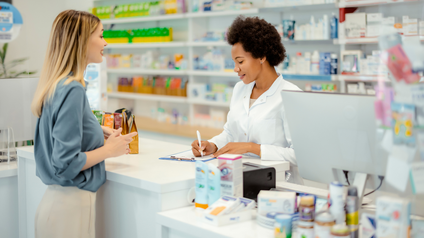 Woman being served in a pharmacy