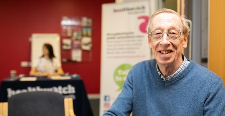 Man at a Healthwatch meeting looking at the camera Man at a Healthwatch meeting looking at the camera