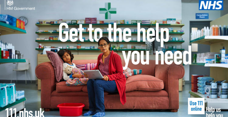 Woman and child sitting on a seat in a pharmacy