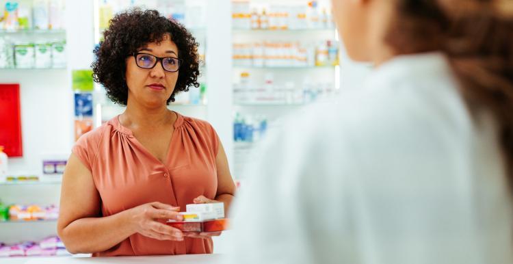 Woman being served in a pharmacy
