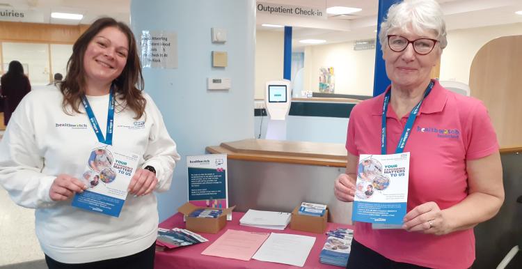 Healthwatch staff member and volunteer smiling at the camera