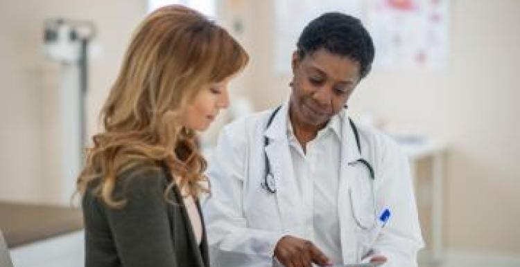 A female doctor with a young woman