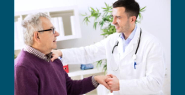 A doctor talking to a patient in his surgery practice