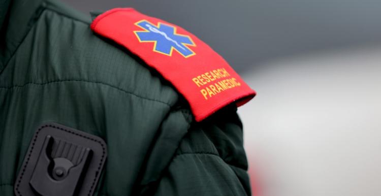 Image of an ambulance worker's badge on their shoulder