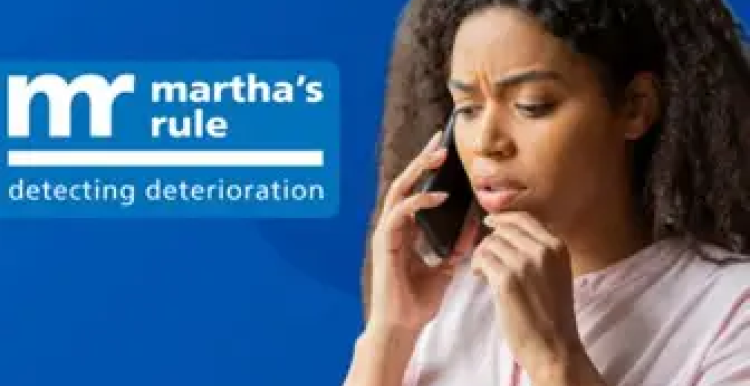A lady holding a mobile phone