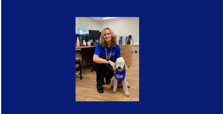 A lady with a therapy dog