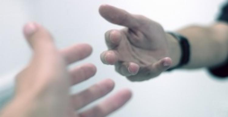 Two hands reaching out