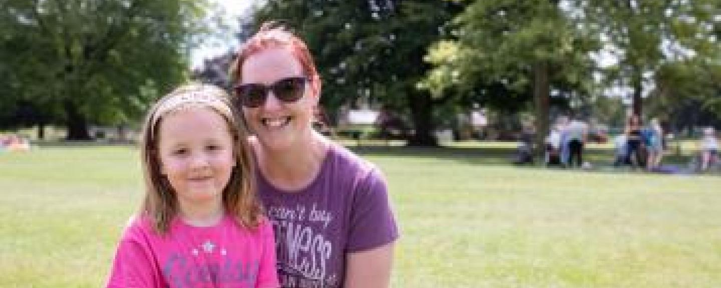 Woman and child smiling at the camera