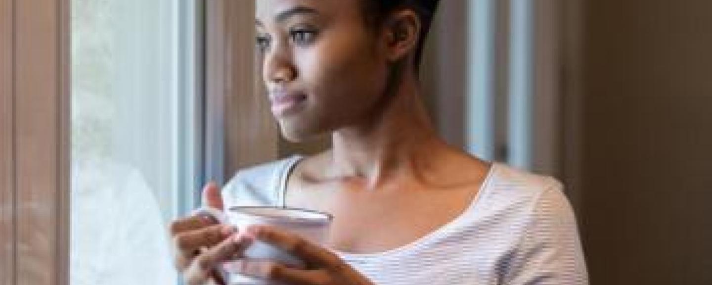 Woman looking out of window