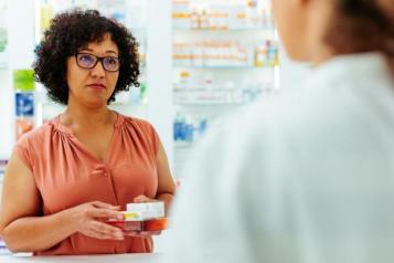 Woman being served in a pharmacy