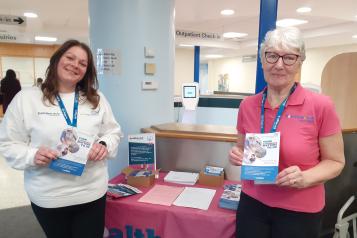 Healthwatch staff member and volunteer smiling at the camera