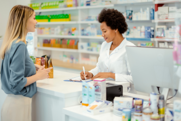 Woman being served in a pharmacy