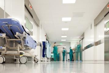 Hospital staff standing in a hospital corridor