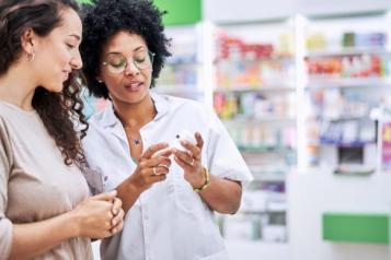 Pharmacist helping a women