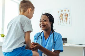 A female doctor with a young child