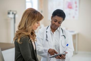 A female doctor with a young woman