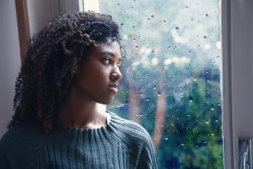 A woman looking out of the window