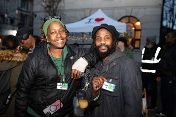 A man and a woman looking at the camera