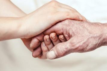 One hand grasping another hand