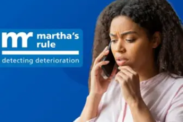 A lady holding a mobile phone