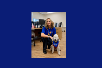 A lady with a therapy dog