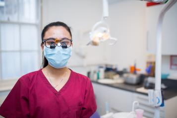 Dentist wearing goggles and mask