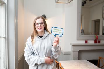 Young volunteer looking at the camera