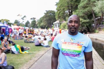 Black man in a blue top