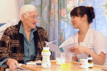 Man in bed with nurse - caring