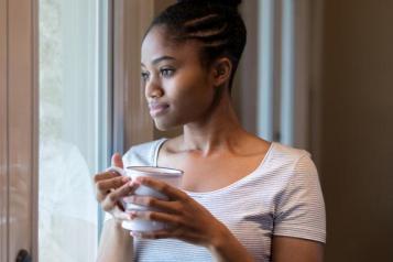 Woman looking out of window