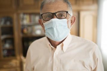 Man in care home wearing a face mask