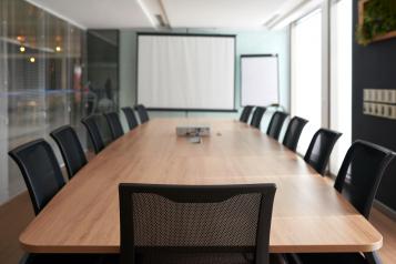 Meeting room with a table and chairs