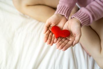 Holding knitted heart