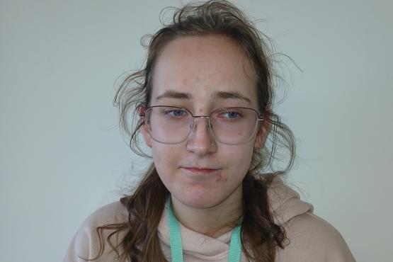 A young lady looking at the camera