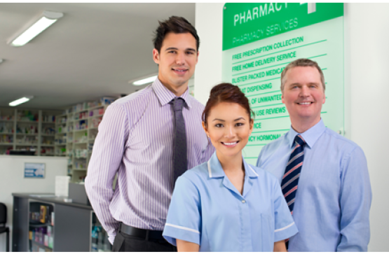 Three people standing looking at the camera