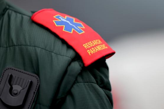 Image of an ambulance worker's badge on their shoulder