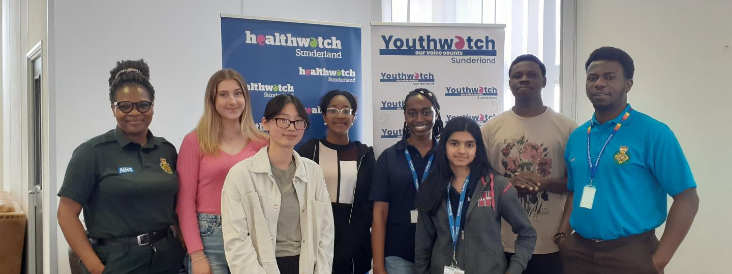 Volunteers at a Healthwatch Sunderland engagement event smiling at the camera