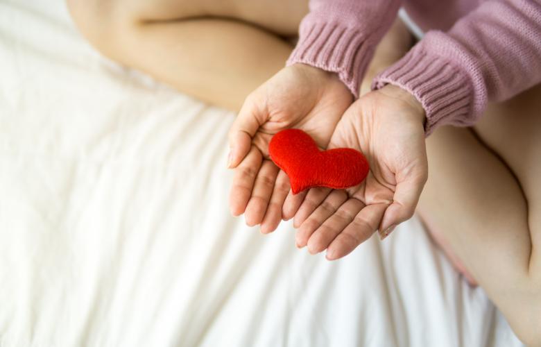 Holding knitted heart