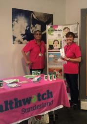 Two women at a Healthwatch Sunderland engagement event smiling at the camera