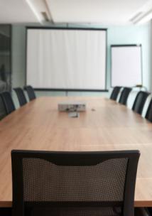 Meeting room with a table and chairs